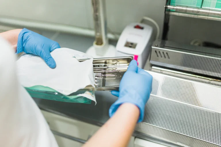 nurse-hand-packing-dental-instrument-plastic-bag_23-2147862117